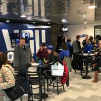 watching game on tv in fieldhouse